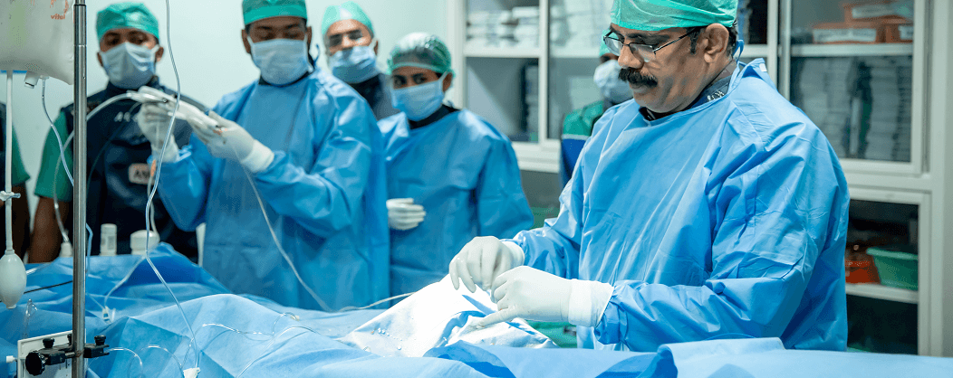 Medical professionals performing cardiac procedure